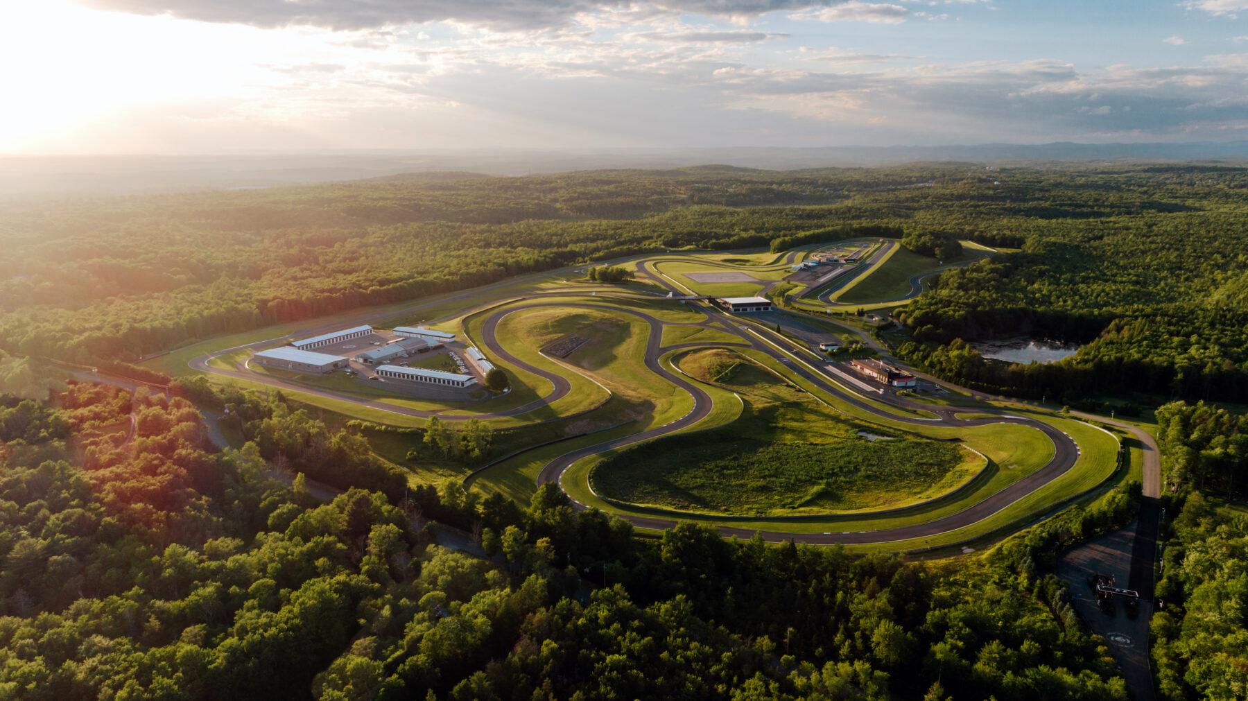 An aerial view of the property during a summer sunset