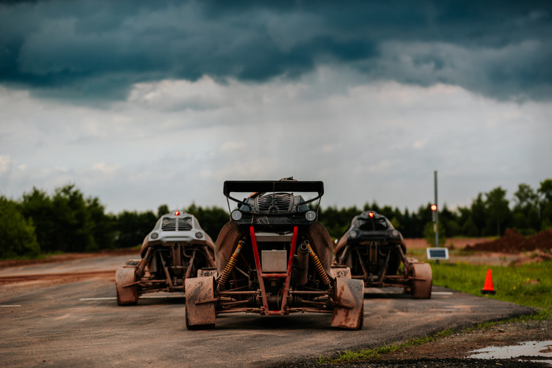 A group of cross karts waiting to race at the starting line