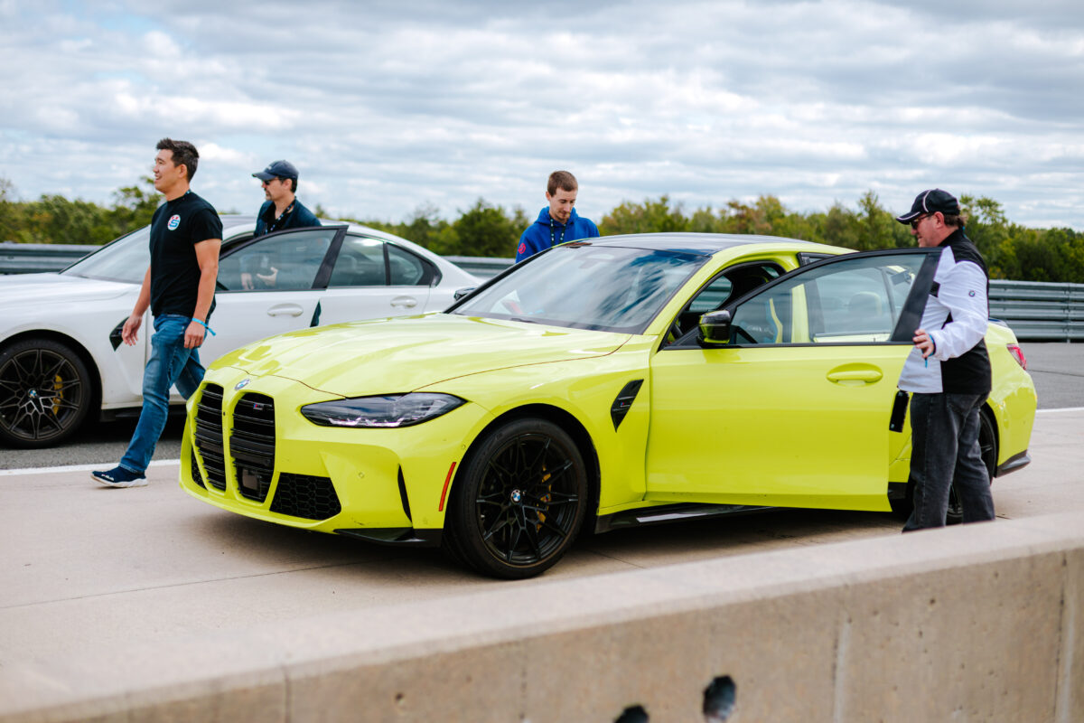 Guest entering BMWs as they prepare to go out on the race track