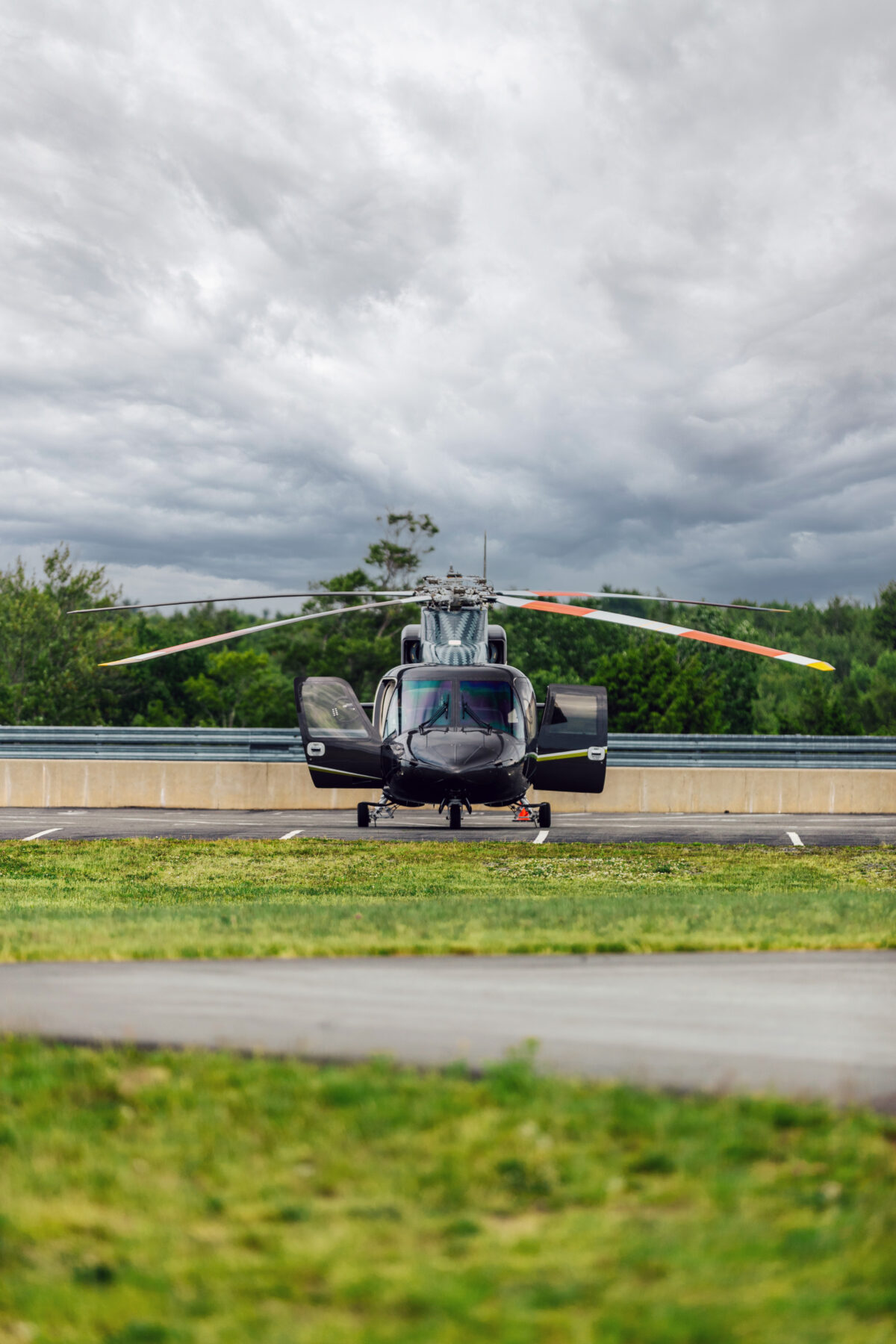 A Helicopter parked in the parking lot