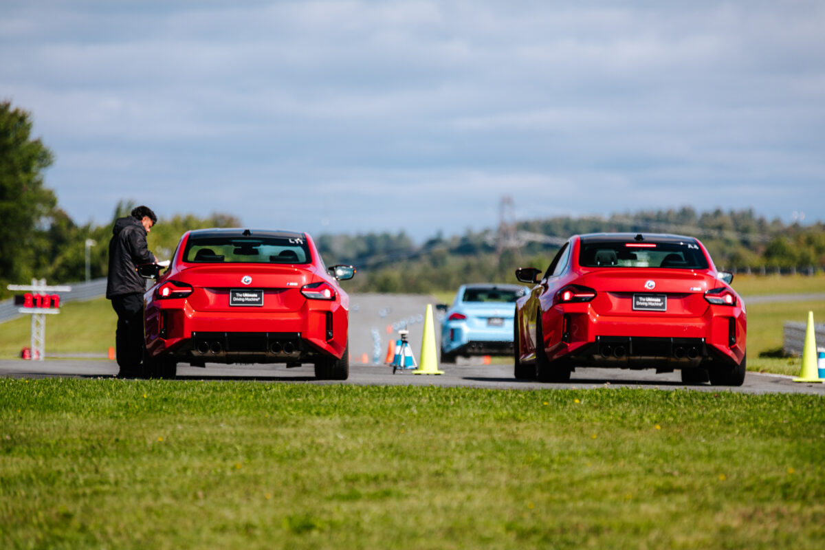 Two red BMW M2s are lining up to race
